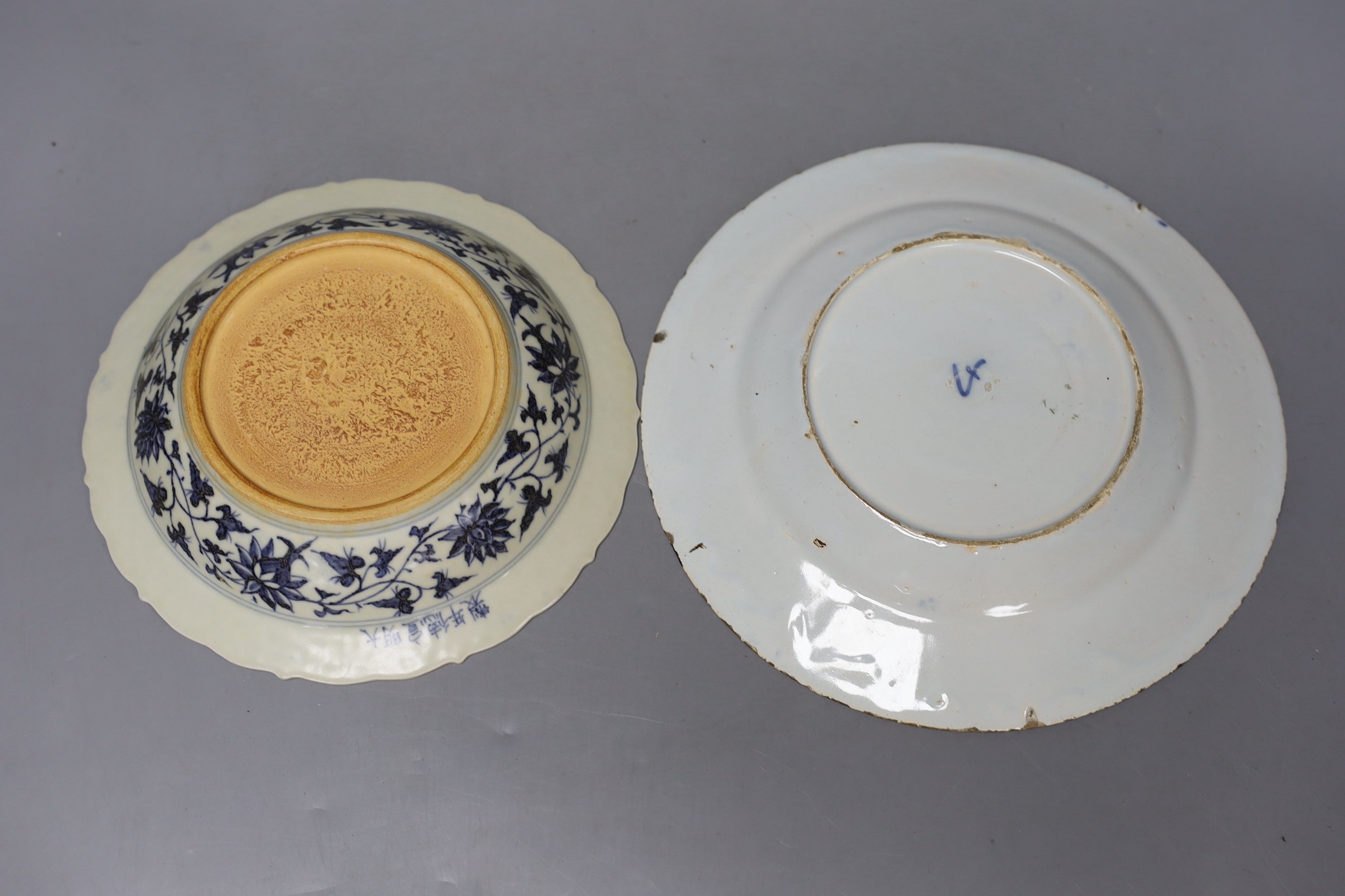 A Chinese sang-de-boeuf glazed pottery incense burner, 21cm high, similar blue and white bowl and a famille rose footed dish together with a Delft plate.